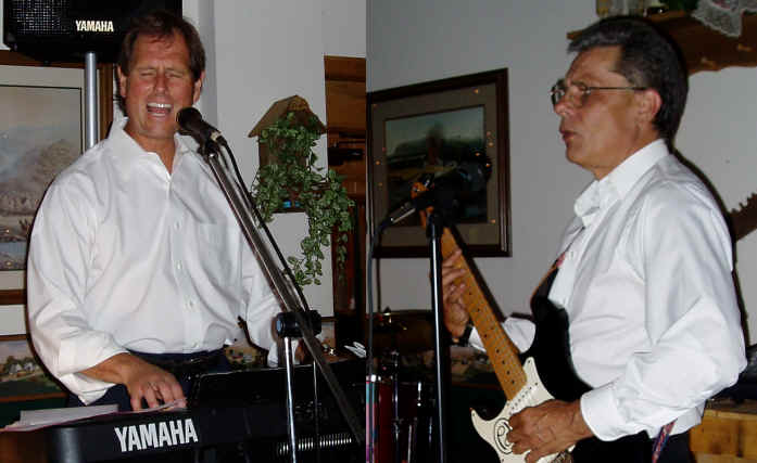 Mike Hicks and Terry Prong perform for a wedding party at The Wonderland Resort